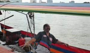 Happy long boat driver