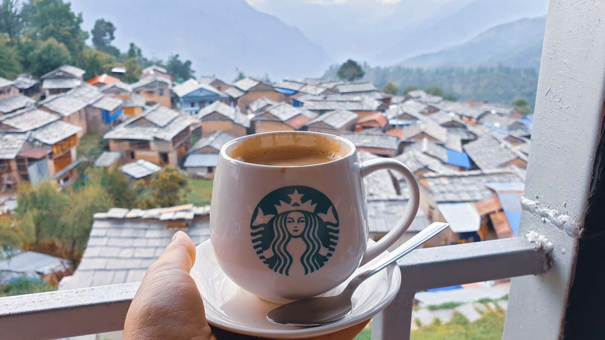 Coffee in a starbucks mug on Mohare Danda trek in Nepal